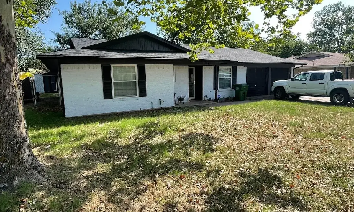 Professional roofing crew working on a residential roof in Mount Vernon